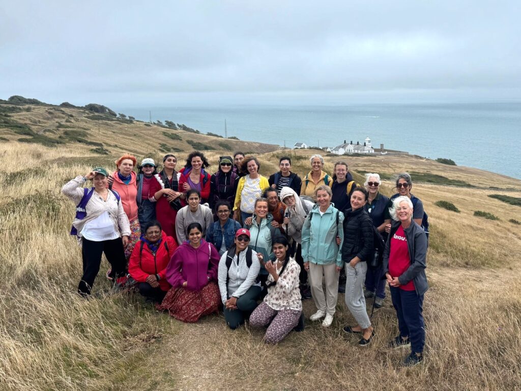Group pf women standing on a cliff at Peverell Point